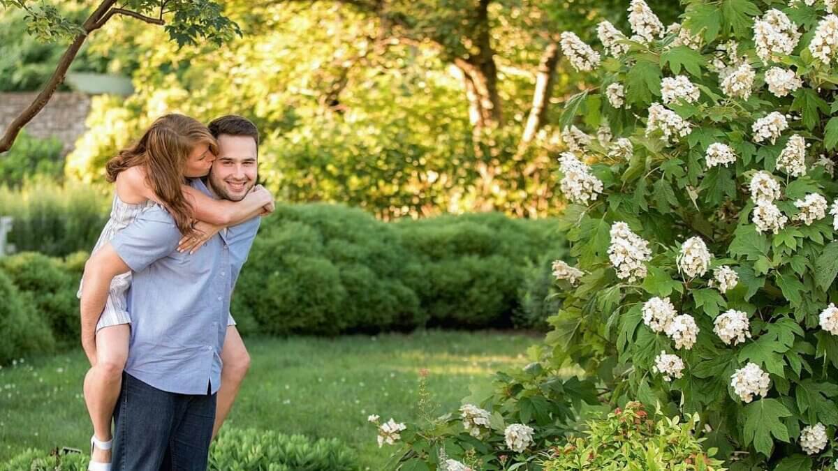 Couple hugging each other at a park.