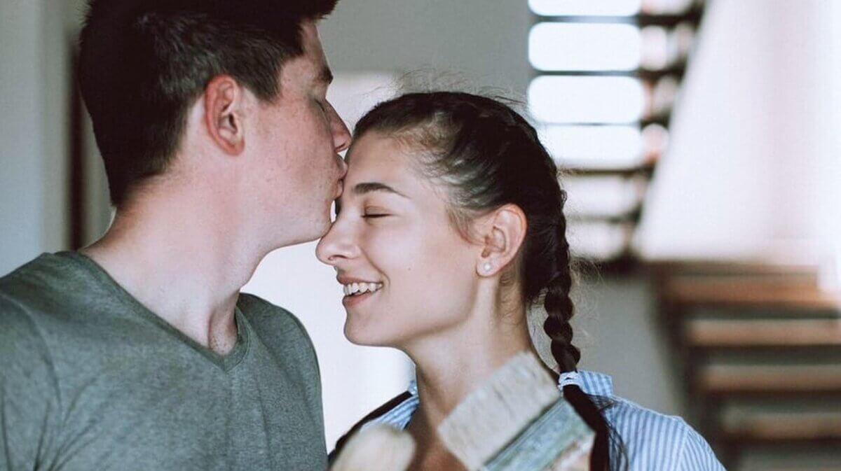 Couple being affectionate with each other.