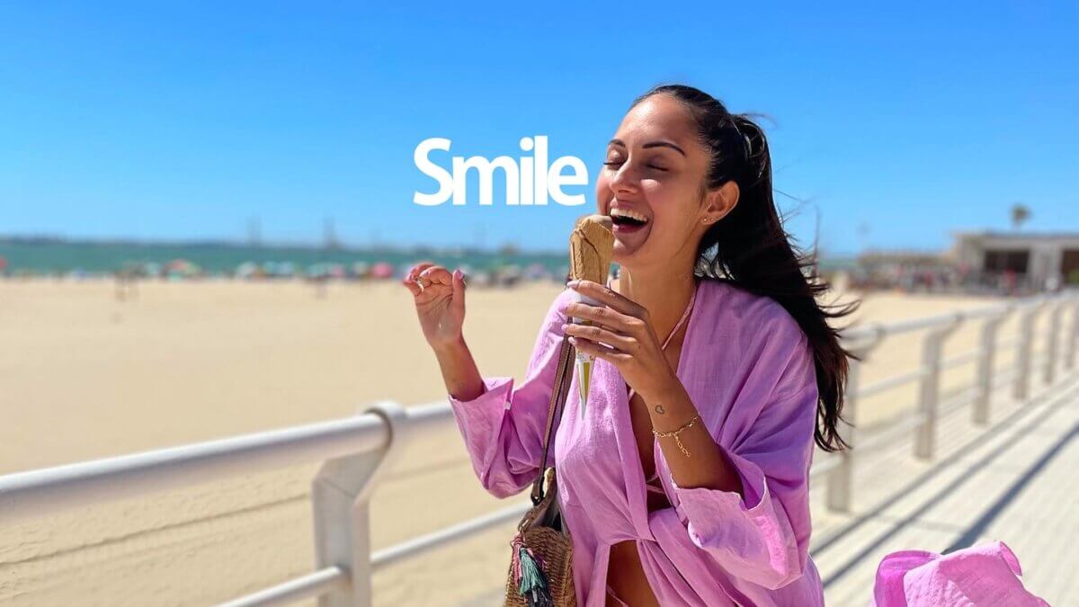 Women smiling and eating ice cream.